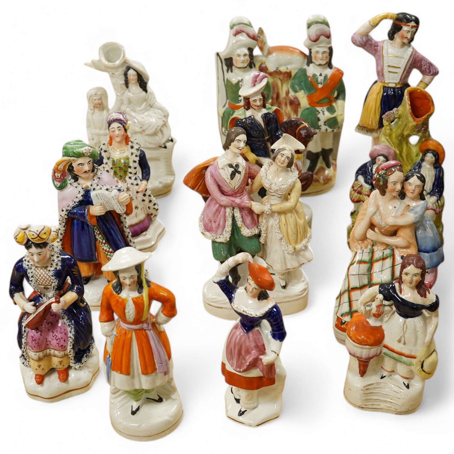 A collection of Staffordshire figures to include some flatback examples, largest 24cm high. Condition - some minor restoration